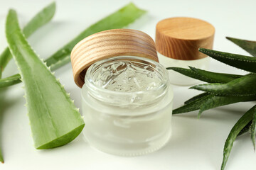 Aloe vera and cosmetics on white background