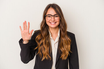 Young caucasian business woman isolated on white background smiling cheerful showing number five with fingers.