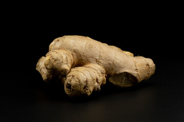 Whole group pile ingredient of fresh ginger group isolated on black background