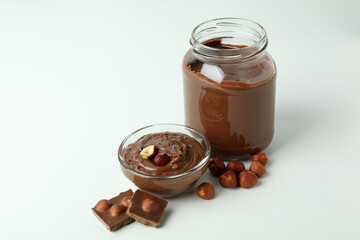 Concept of delicious food with chocolate paste on white background