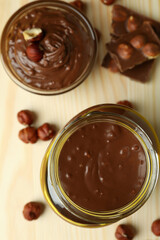 Concept of delicious food with chocolate paste on wooden board