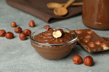Concept of delicious food with chocolate paste on gray textured table
