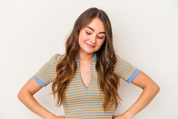 Young caucasian woman isolated on white background dreaming of achieving goals and purposes
