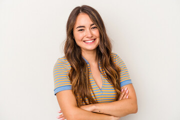 Fototapeta premium Young caucasian woman isolated on white background who feels confident, crossing arms with determination.