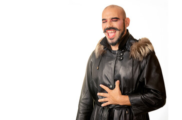 Obraz premium Caucasian man with drag makeup dancing and singing in leather coat on white background and copy space