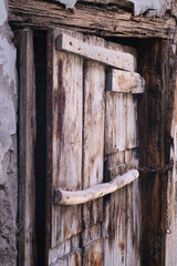 Vintage rough wooden texture of medieval cracked door