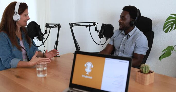 Hosts having podcast session together - Female speaker making an interview during live stream - Technology trends concept 