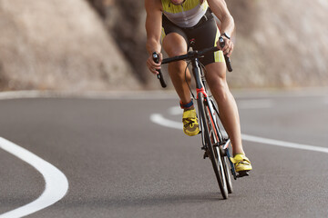Fototapeta Road bike cyclist man cycling, athlete on a race cycle obraz