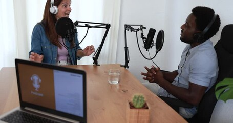 Hosts having podcast session together - Female speaker making an interview during live stream - Technology trends concept 