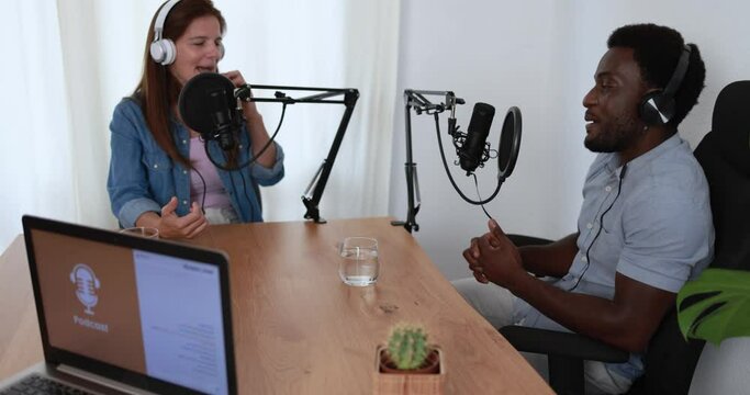 Hosts having podcast session together - Female speaker making an interview during live stream - Technology trends concept 