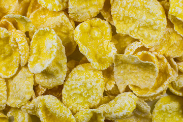 Yellow Cornflakes close up photo, Food texture background, top view. Macro shot. Perfect breakfast.