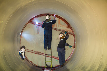 Working male two inspection weld underground of equipment tunnel