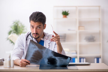 Young male doctor radiologist working in the clinic