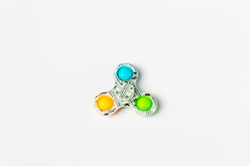 Fidget spinner stress relieving toy on white  background. hand toy known as hand spinner it is very...