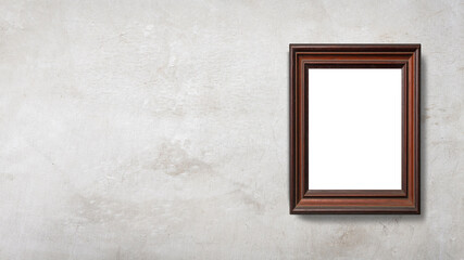 コンクリートの壁に掛けられた空白の額縁