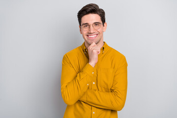 Portrait of attractive glad cheerful man manager analyst thinking isolated over grey color background