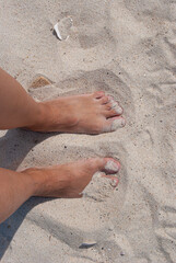 White sand. Feet in the sand. 