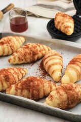 Preparation Making Croffle:  Coating Raw Croissant Dough with Palm Sugar and Cinnamon Powder