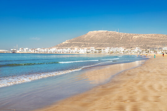 Beach and yellow sand on the coastline of Agadir in the summer season in Morocco, Africa