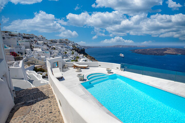 Santorini, Greece landscape, pool caldera view with flowers blue doors. Romantic couple destination...