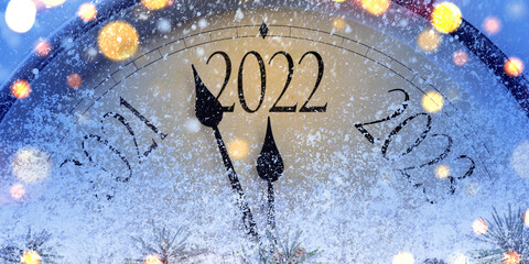 Countdown to midnight. Retro style clock counting last moments before Christmas or New Year 2022