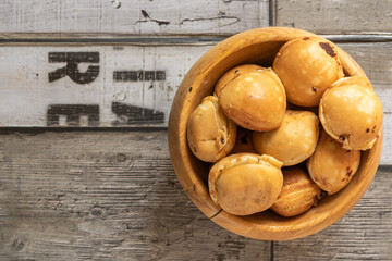 Kaya ball in a wooden bowl placed on a wooden background