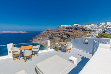 Summer vacation urban scenic of luxury famous destination. White architecture in Santorini, Greece. Perfect travel scenery with terrace sunny blue sky, sea bay. Romantic street views. Traveling Europe - obrazy, fototapety, plakaty