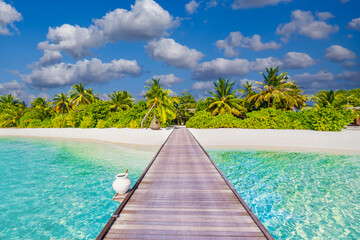 Idyllic tropical beach landscape for background or wallpaper. Design of tourism for summer vacation holiday destination. Maldives island beach panorama. Palm trees and beach bar and long wooden pier