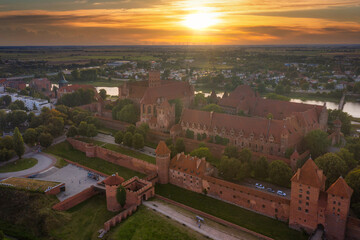 Fototapeta na wymiar Beautiful Malbork castle over the Nogat river at sunset, Poland