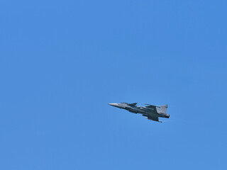 Fototapeta na wymiar Fighter in flight in the sky