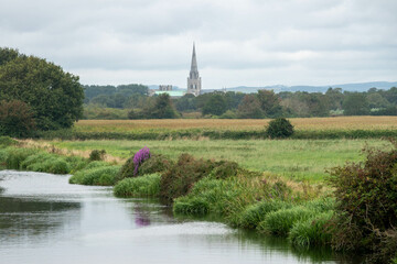 view of Chichester Cathedral along the canal at Poyntz Bridge in Hunston
