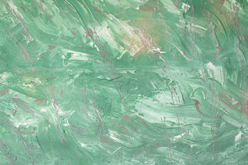 Green background with dynamic paint strokes and malachite splashes. Spring or summer background. Drawn. Copy space