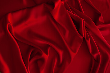 Obraz premium Red fabric texture background. Silk satin folds