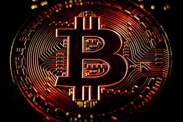 gold coin bitcoin. close-up. Black background. macro
