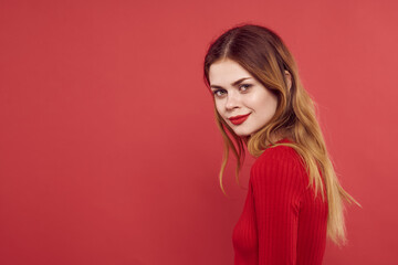 woman in red sweater makeup attractive look red background