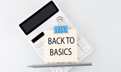 BACK TO BASICS text on the sticker on white calculator