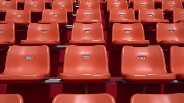 Many empty seats in the stadium.
