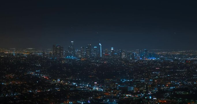 Timelapse of Los Angeles at night. Big city in the USA. Skyscrapers and street lights with traffic