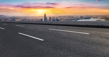 Fototapeta premium Panoramic skyline and empty asphalt road with modern buildings
