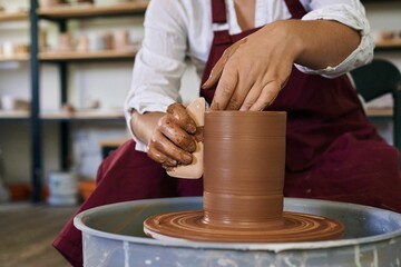 making ceramic pottery on a potter's wheel close-up