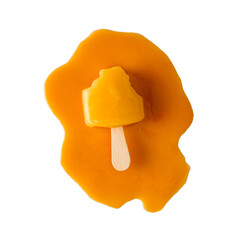 Orange ice lolly ice block with bites taken out sitting in a pool of orange melt liquid on a white background