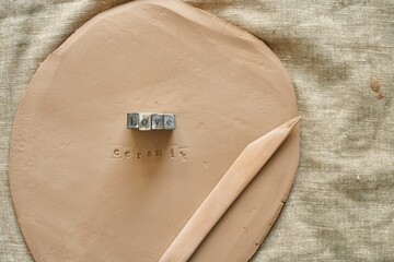 clay slab with wooden tools for handmade craft with imprint love ceramic