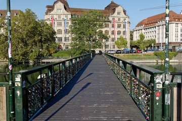 Mühlesteg bridge Zurich: september, 14. 2021 many bicycle locks attached to the bridge as a symbol of love and living together. bahnhofquai in the background at day wide angle shot