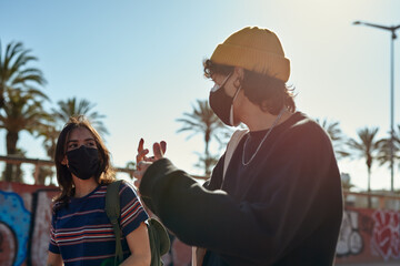 Two lively people having a conversation on the go