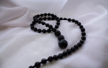 black women's beads on a white background