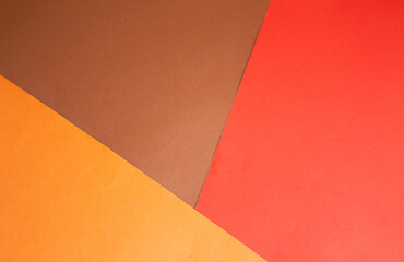 red, brown, orange paper. geometric background