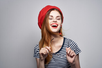 Frenchwoman in a striped t-shirt red lips gesture with his hands Fresh air