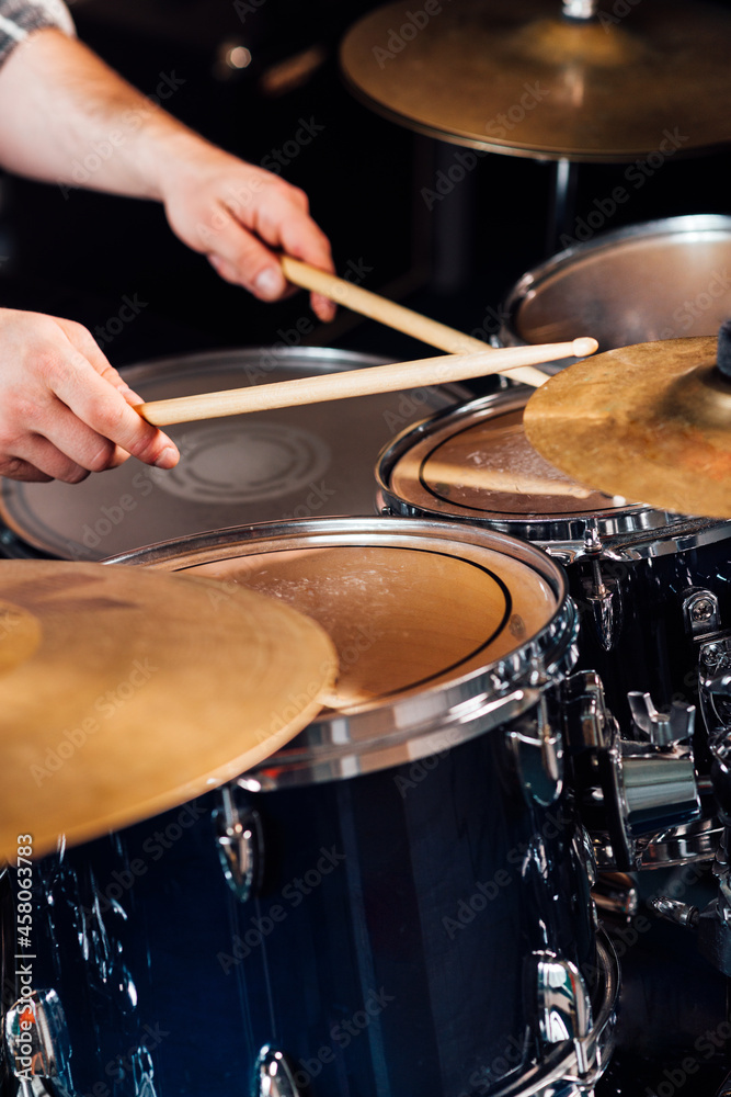 Wall mural fragment of a drum kit close up. the drummer beats the drum.