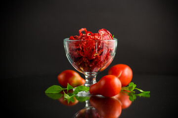 a handful of dried tomatoes and fresh tomatoes