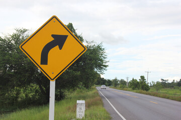Right Turn Sign: A sign warns of a sharp right turn on a country road in southern Wisconsin